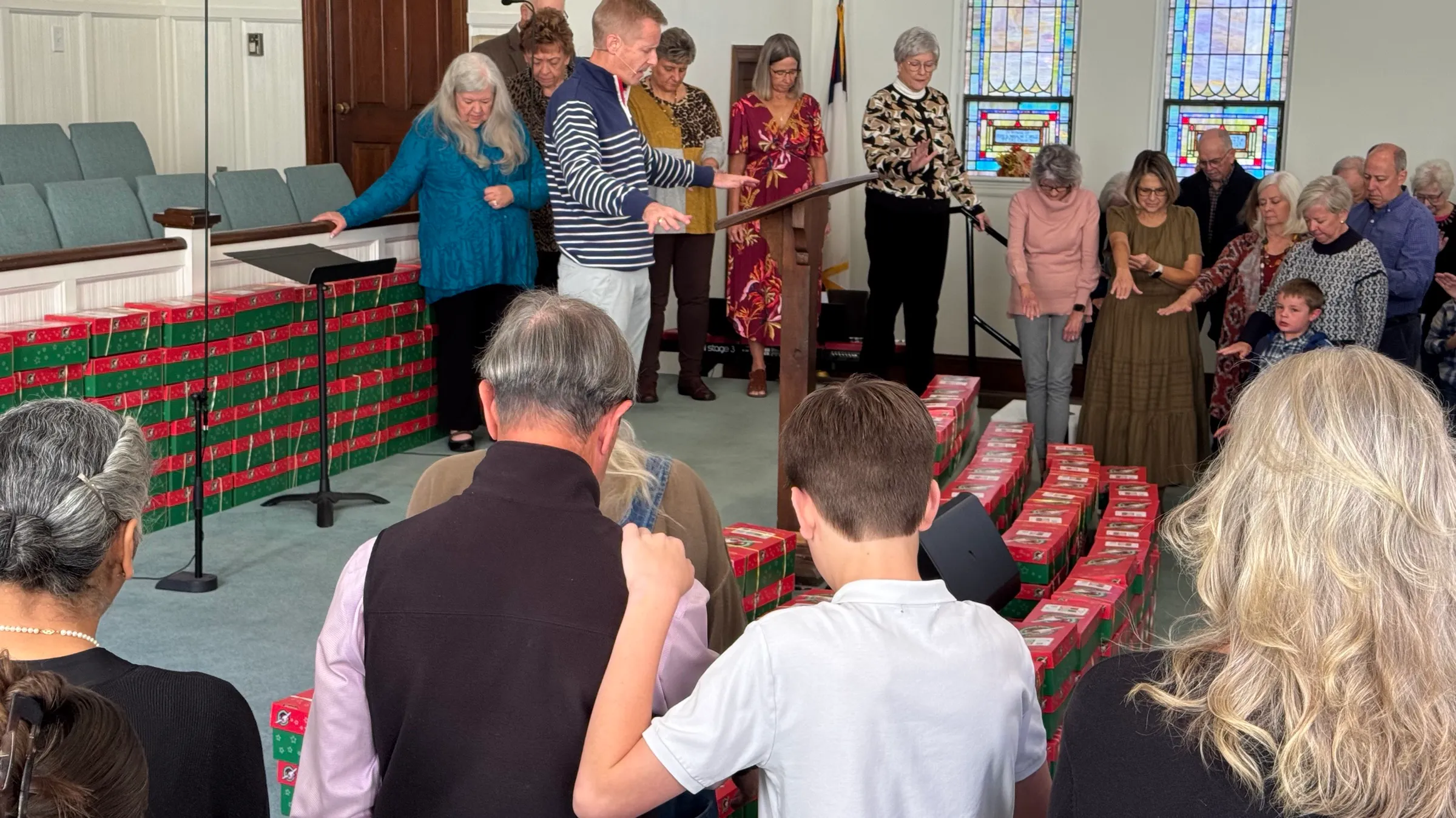The congregation praying together