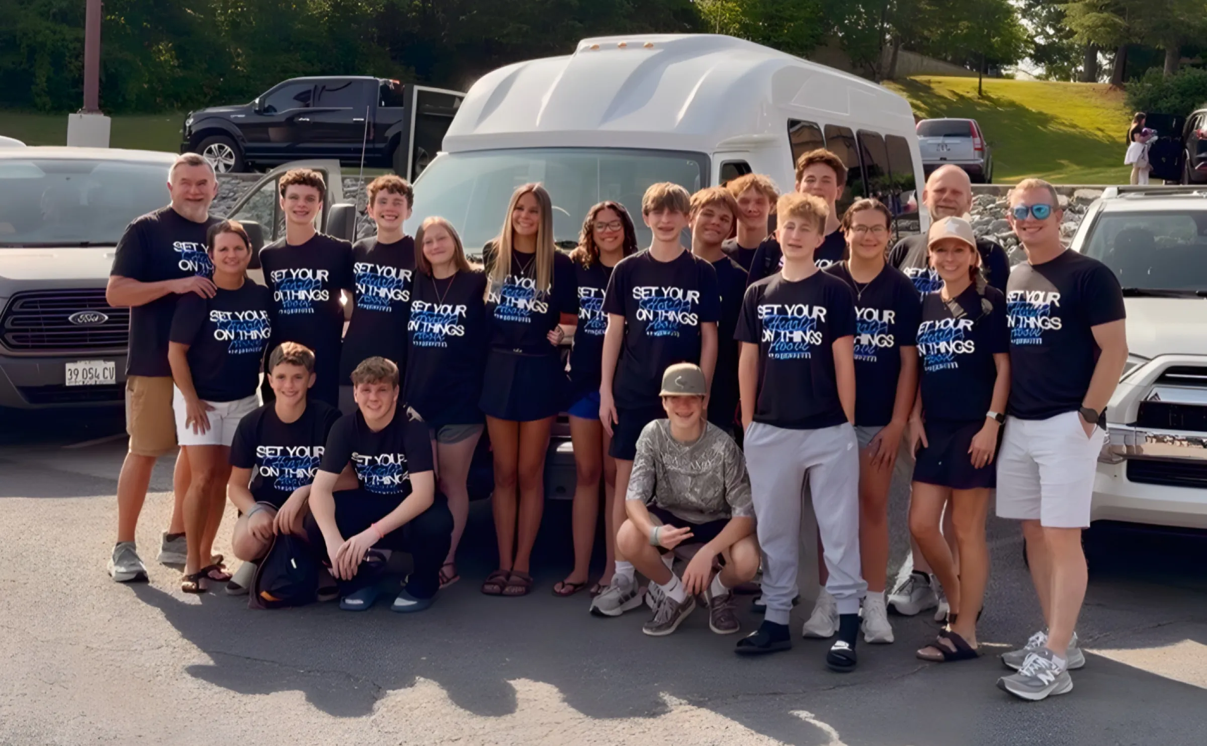 Alexis Youth students in front of the church van before camp